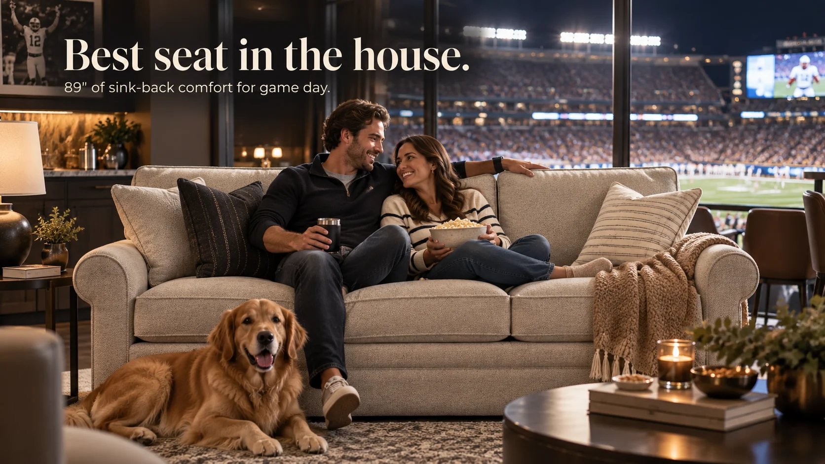 Campaign banner: couple with popcorn and dog on the Collins sofa watching football — "Best seat in the house. 89in of sink-back comfort for game day."