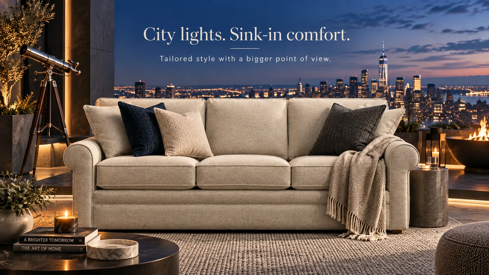 Campaign banner: Collins sofa on a penthouse terrace above a city skyline — "City lights. Sink-in comfort."