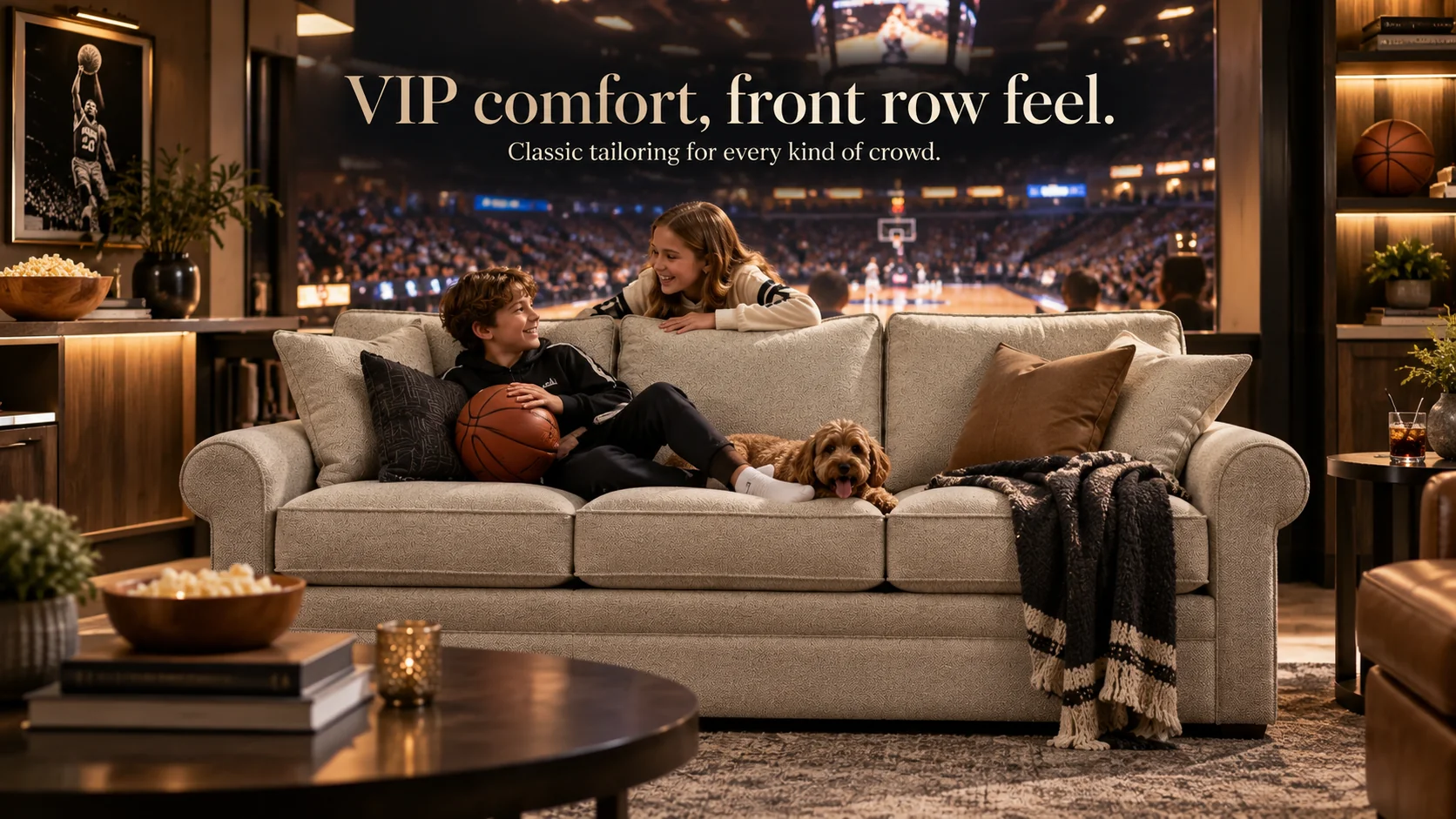 Campaign banner: kids and dog on the Collins sofa watching basketball — "VIP comfort, front row feel. Classic tailoring for every kind of crowd."